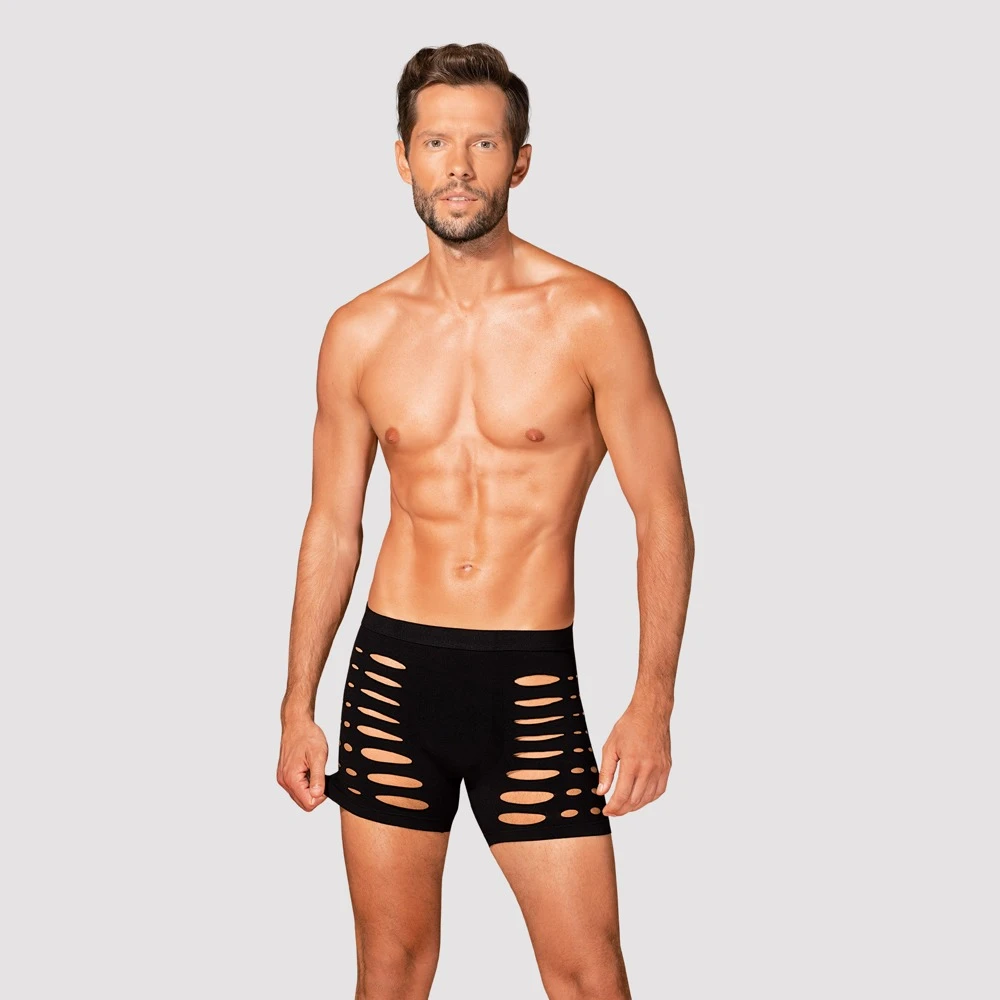 Obsessive Schwarze Radlerpants mit aufregenden Cut-outs auch über dem Po. Mit bequemem Bundgummi und rundum weich und elastisch für vollen Komfort.